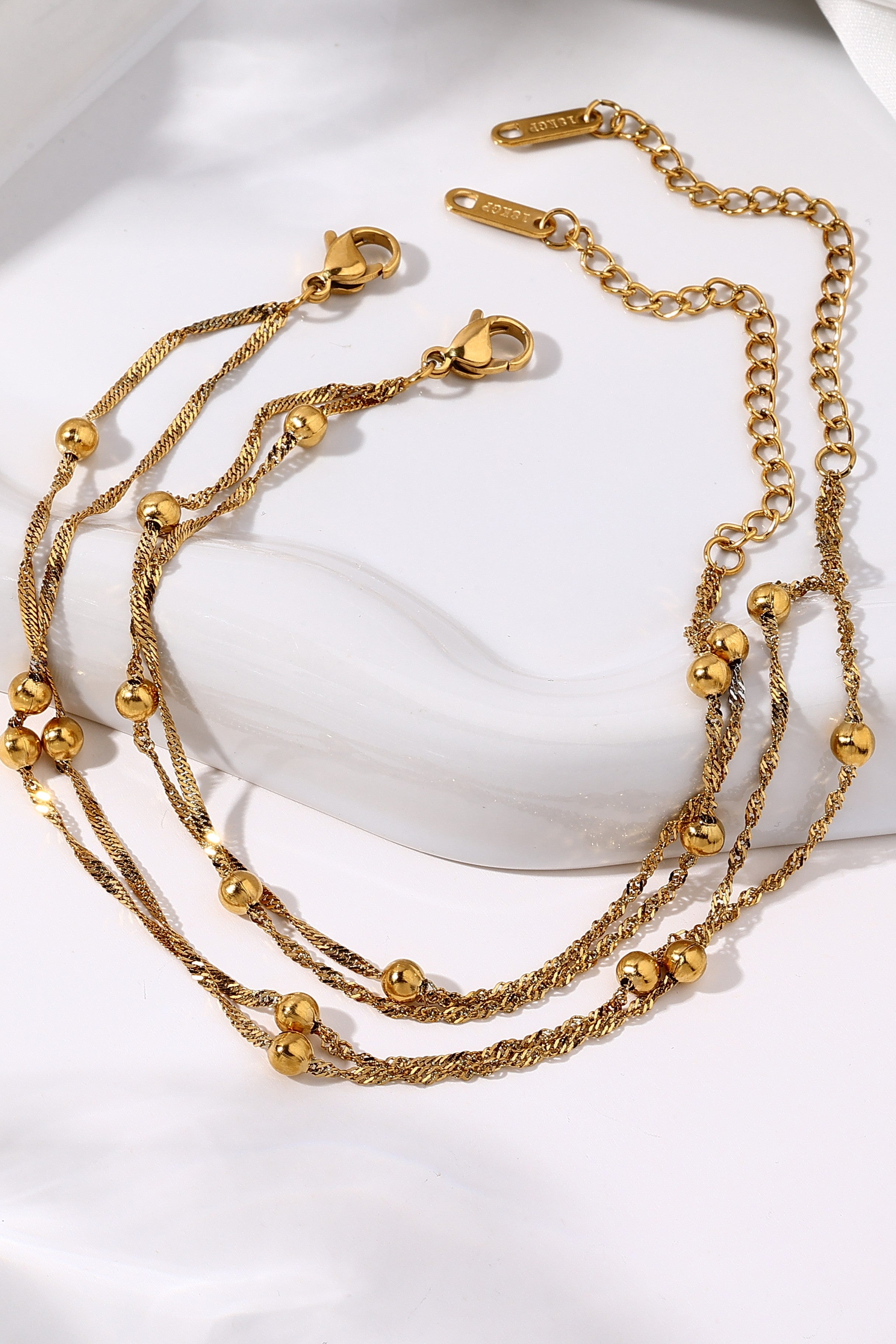 Pack Duo — Bracelet & Chevillère acier plaqué or